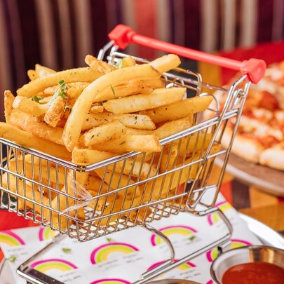 Hot chips in a mini trolley basket.