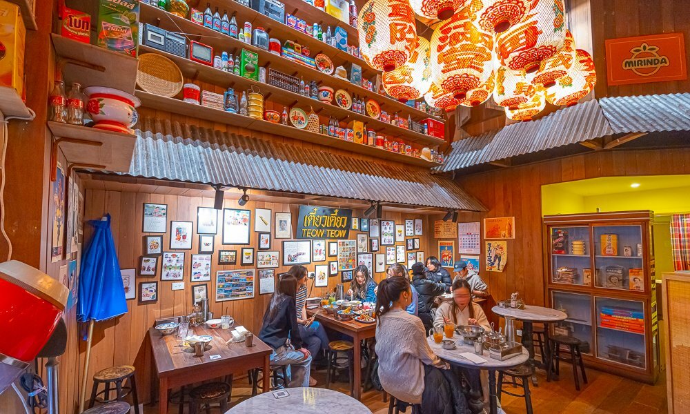 Inside a Thai restaurant with lanterns hanging from the ceiling. 