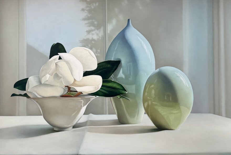 A still life painting by Julie Davidson showing three objects, one holding white magnolias.