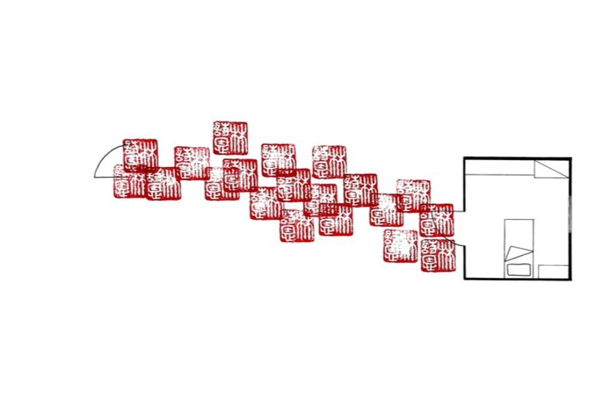Print artwork of a single room floor plan with red rubber stamp markings creating a path from the door into the room out to the edge of the artwork.