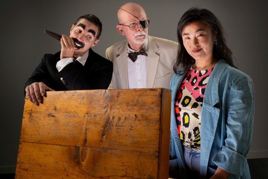 Three people in character dressed as Groucho Marx, James Joyce and a young woman. 