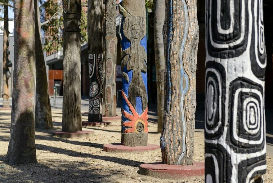 Carved and decorated trees, as part of the Scar artwork.