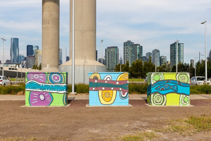 Colourful Aboriginal mural paintings on electrical boxes. 