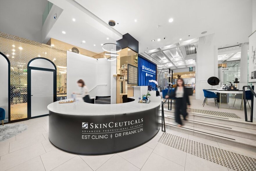 Skincare store foyer with signage on reception desk.