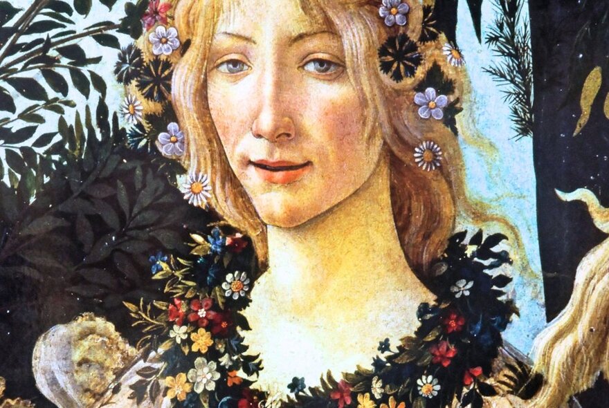 Sandro Botticelli’s La Primavera, an oil portrait of a young woman with flowers in her hair and a floral wreath necklace.