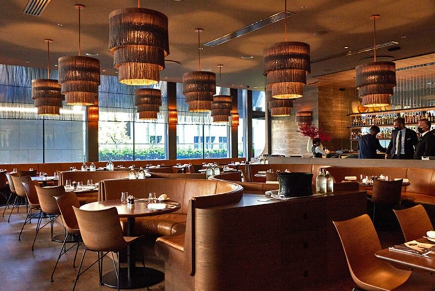 Sophisticated restaurant and bar with pendant lights.