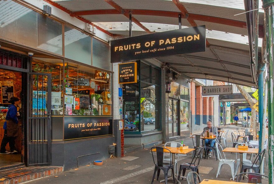A man sitting outside a cafe.