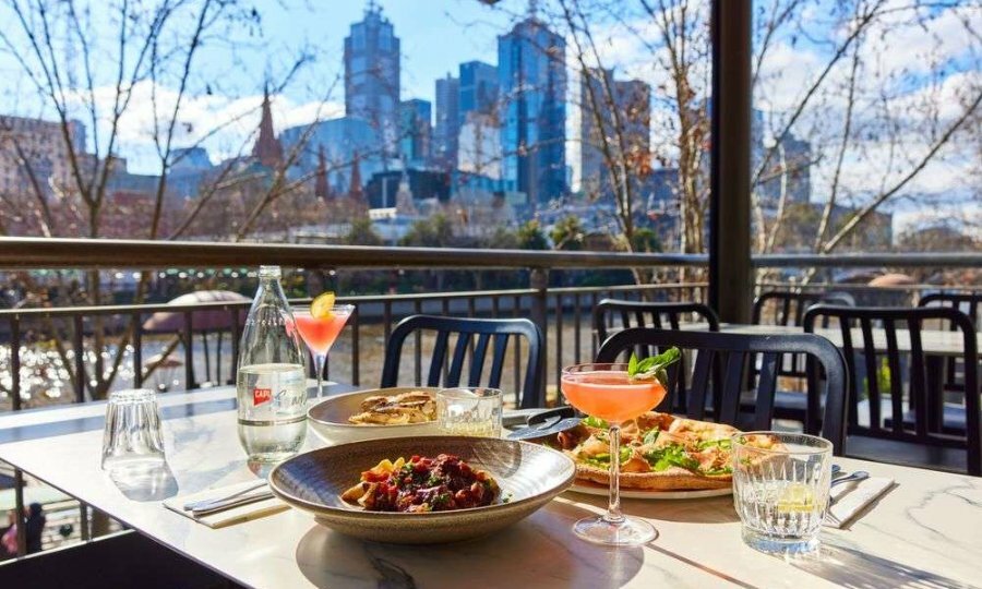 Food and cocktails on a table outside