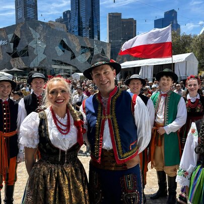 People in Polish traditional dress in Federation Square. 