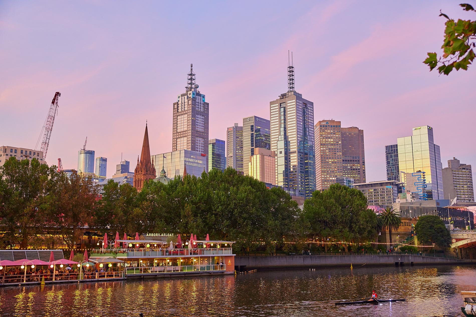 A floating bar in the city at sunset.