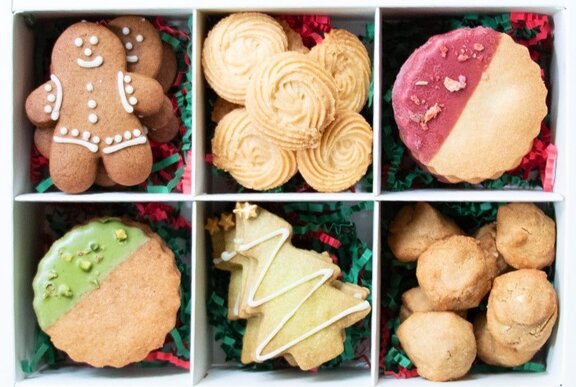 Overhead view of a box of festive Christmas cookies.