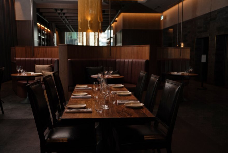 An empty restaurant table with seating for four.