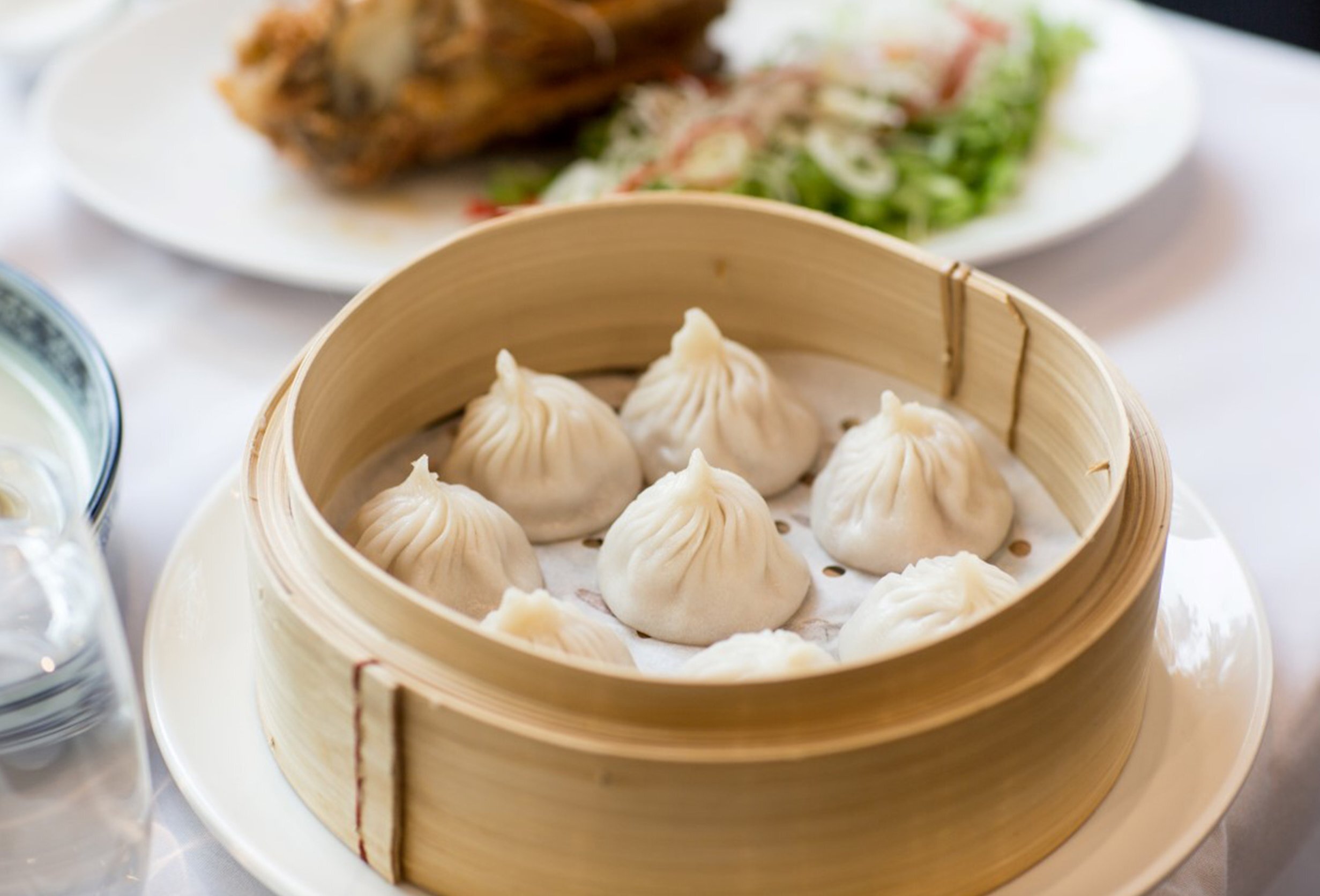 A steamer basket full of soup dumplings