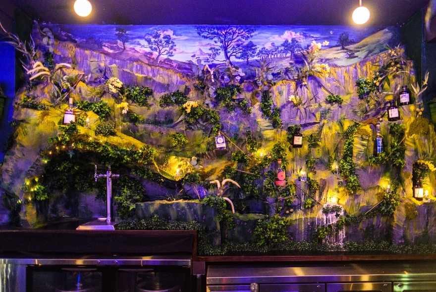 Interior of Yarra Falls bar showing the waterfall feature behind the long wooden bar.