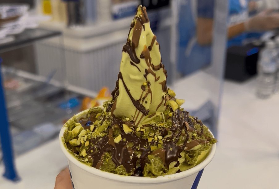 Pistachio soft serve in a cup