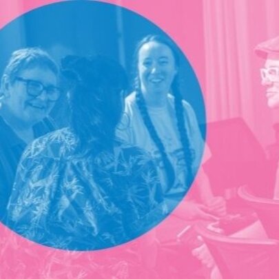 Four people smiling and talking to each other, seated in armchairs; the image is two-toned, with a blue circle over a pink filter.