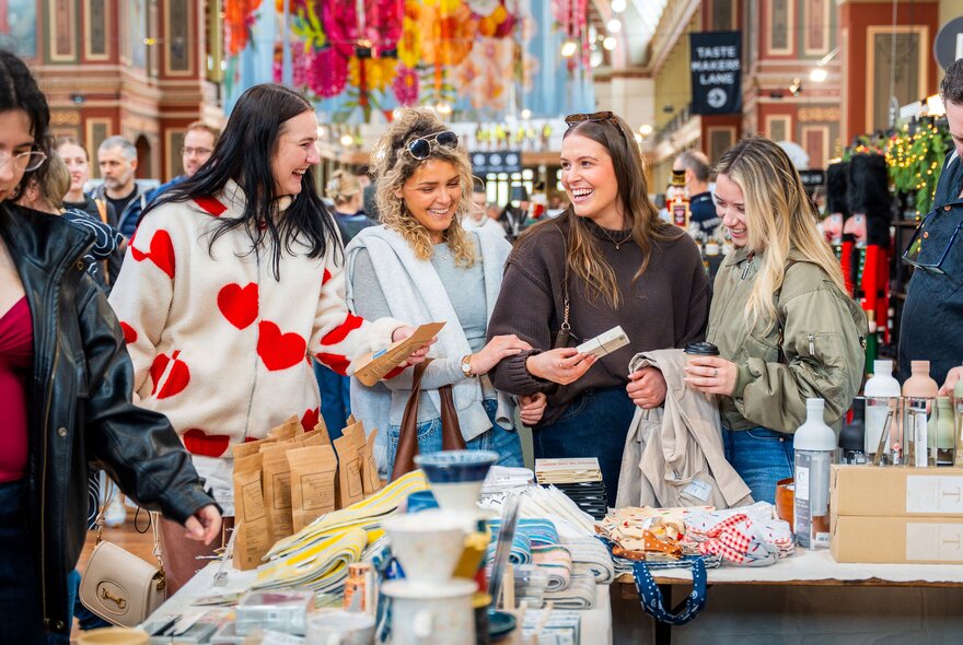 People looking at stalls at a market in Royal Exhibition Building.