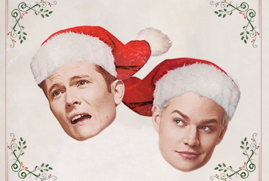 The portraits of two young men wearing Santa hats superimposed onto a traditional-style Christmas card background.
