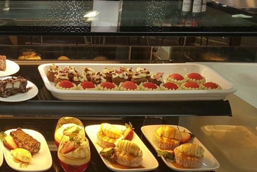 Pastries in a display cabinet.