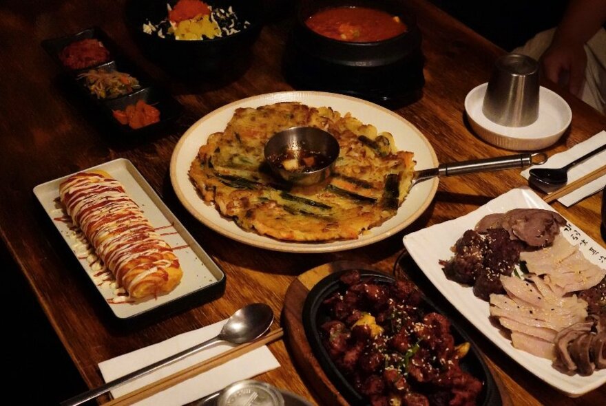 A table laden with Korean delicacies.