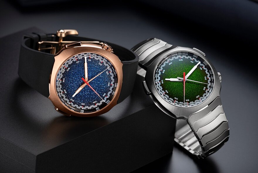 Rose gold and silver men's watches with coloured dials.