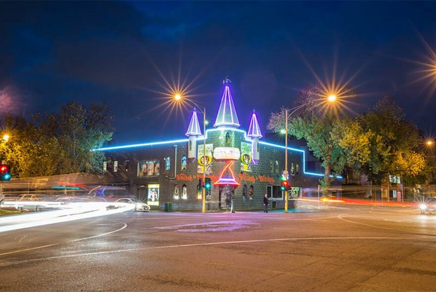 Outside the Witches in Britches Theatre Restaurant at night.