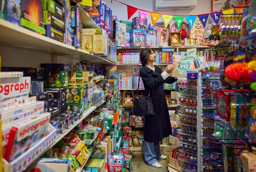 Person shopping in toy shop.