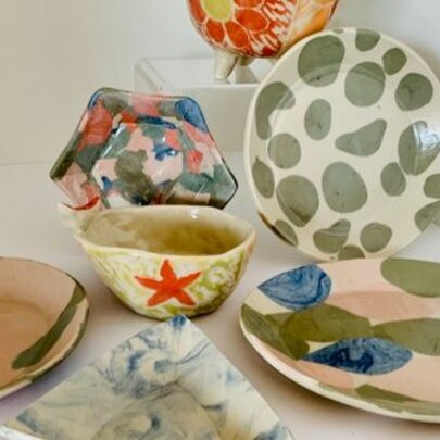 An assortment of hand made ceramics in various designs.