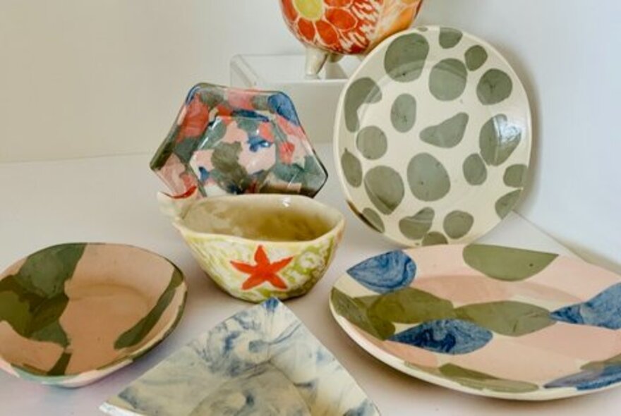 An assortment of hand made ceramics in various designs.