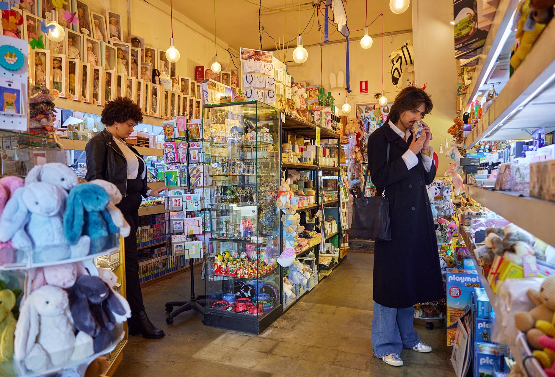 Two friends browsing in a toy shop.