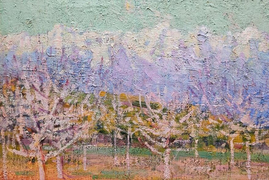 An impressionist painting of trees in blossom.