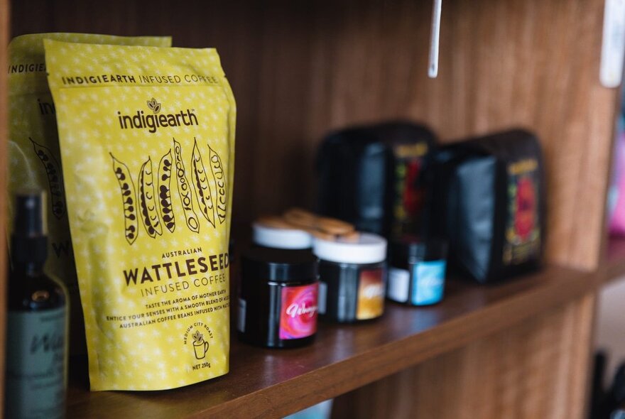 Products for sale on display in a shelf in a shop.