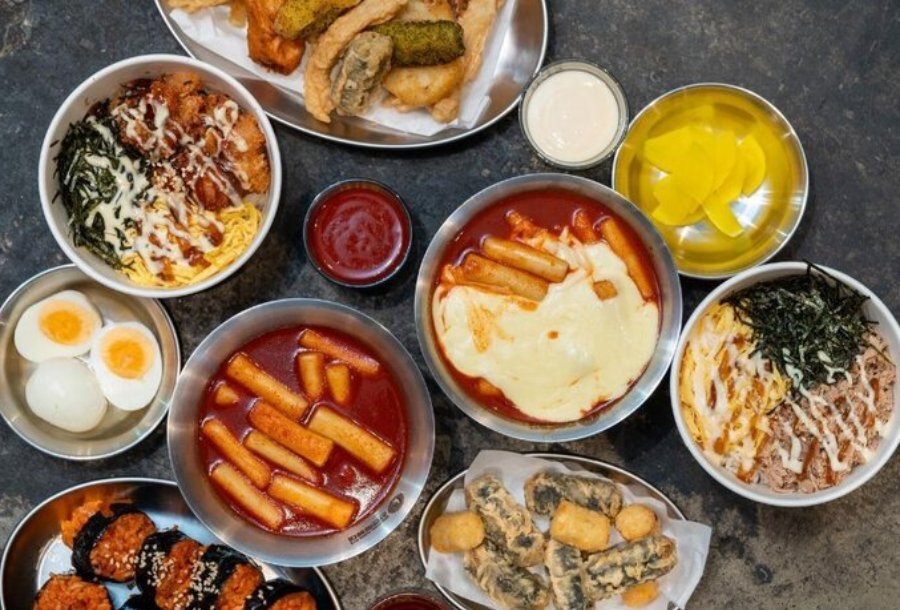 A table filled with Korean food plates.