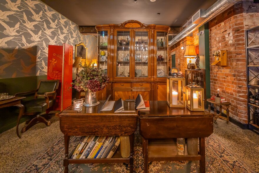 A rustic looking room with books on shelves and old furniture. 