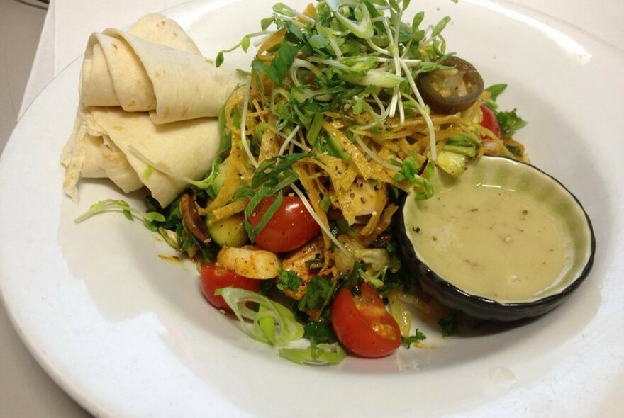 Mexican dish with tortillas and dip.