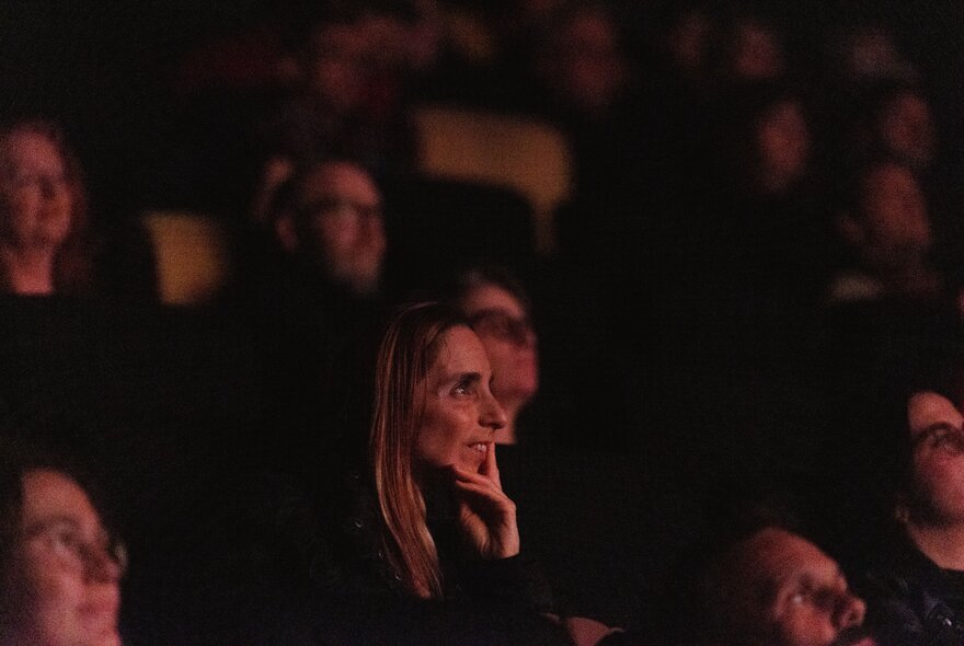 An audience watching a film.