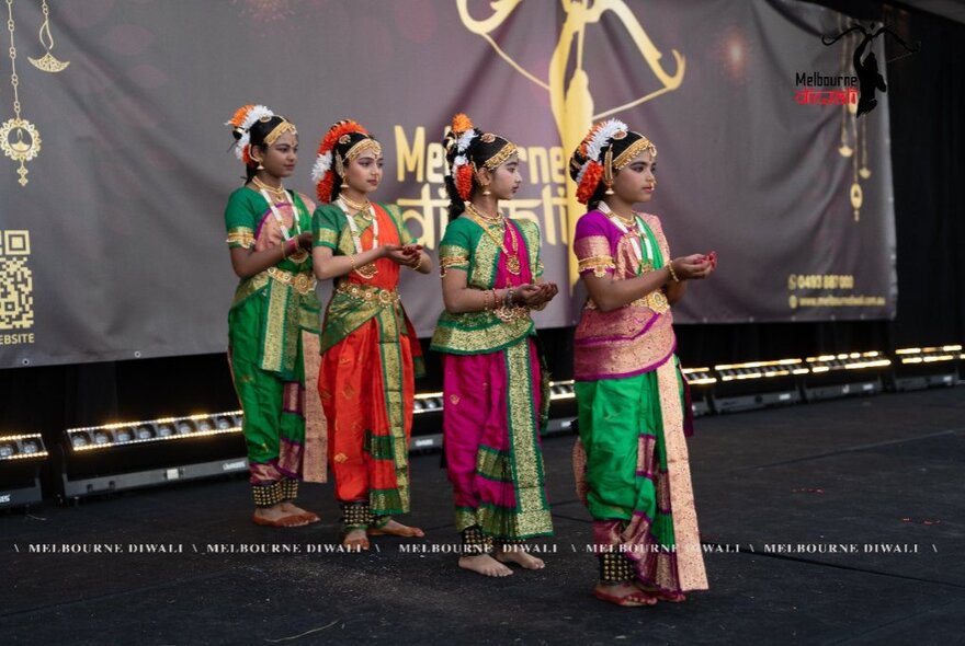 A group of dancers performing on stage at Marvel Square as part of Diwali celebrations.