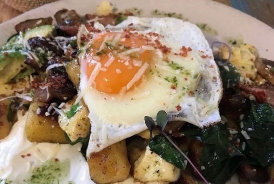 Breakfast dish of fried egg and potatoes.