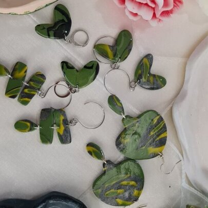 Sets of green hand-made earrings.