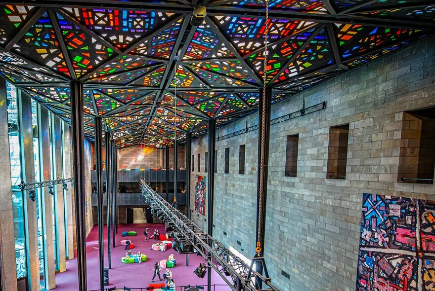 A large hall with a stained glass ceiling.