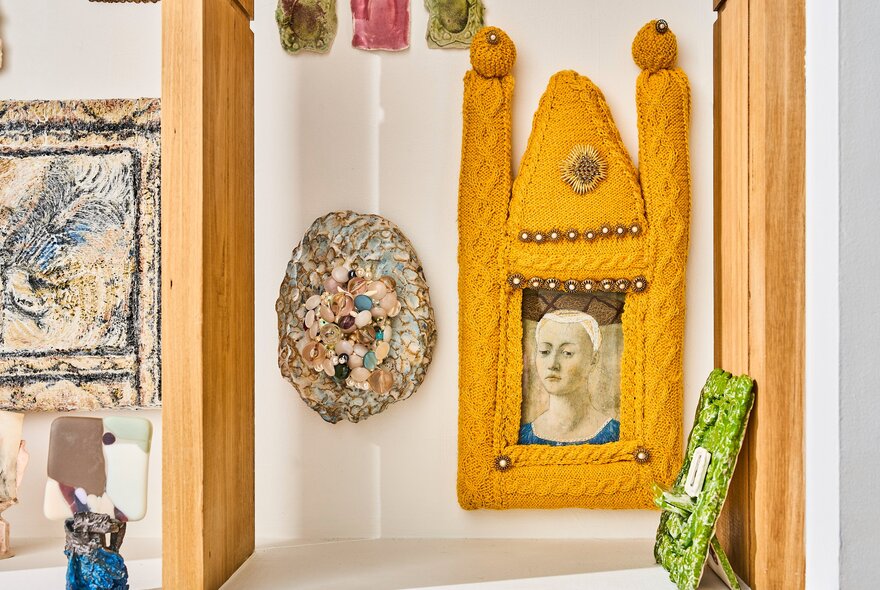Small framed artworks on display on the white walls of the gallery space at Craft.