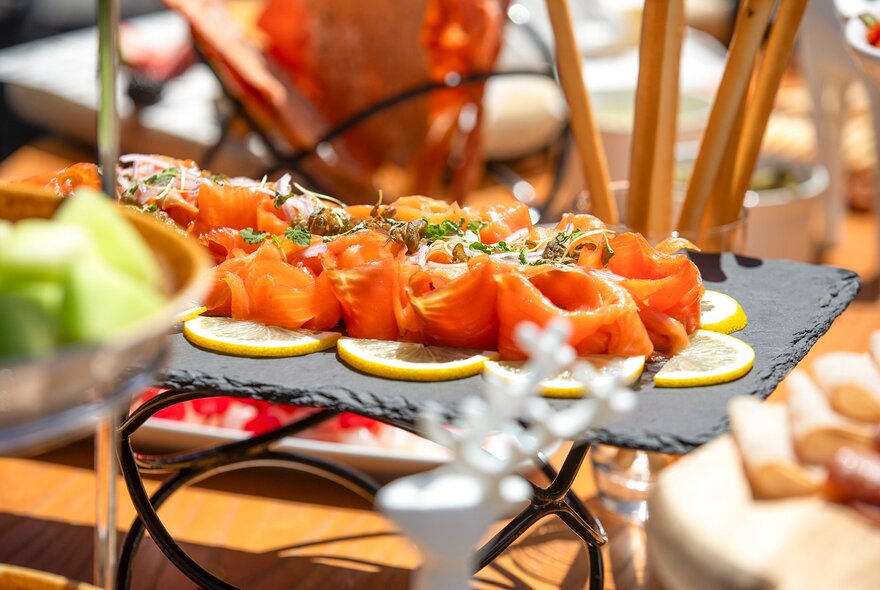 Salmon canapes in a festive display of dishes.