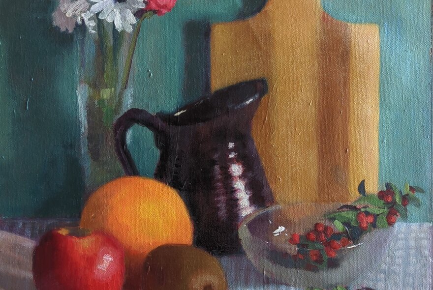 A realist still life oil painting of three pieces of fruit, a ceramic jug, a vase of flowers, resting on a table. 