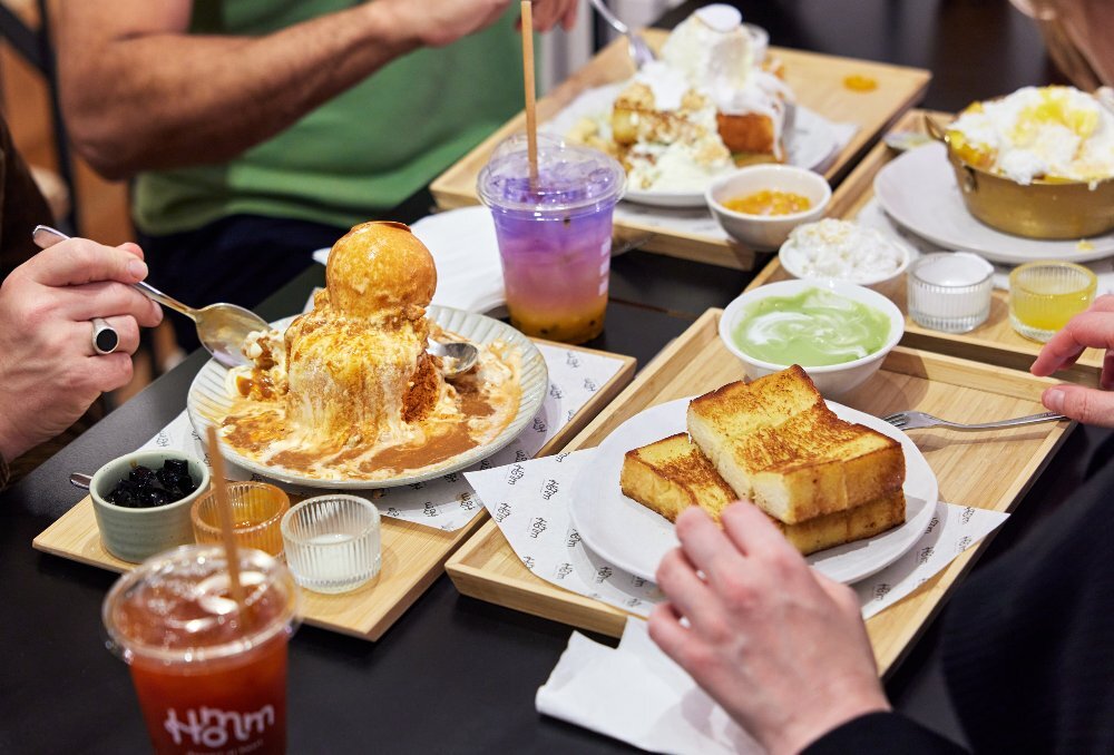 A table with bingsu, kaya toast and dessert drinks.