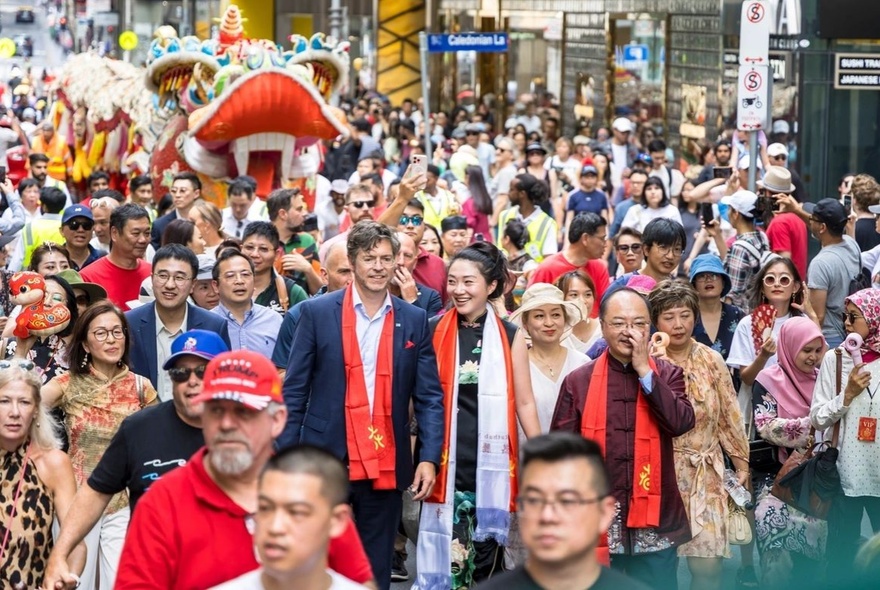 Crowded Chinatown streets thronged with people.