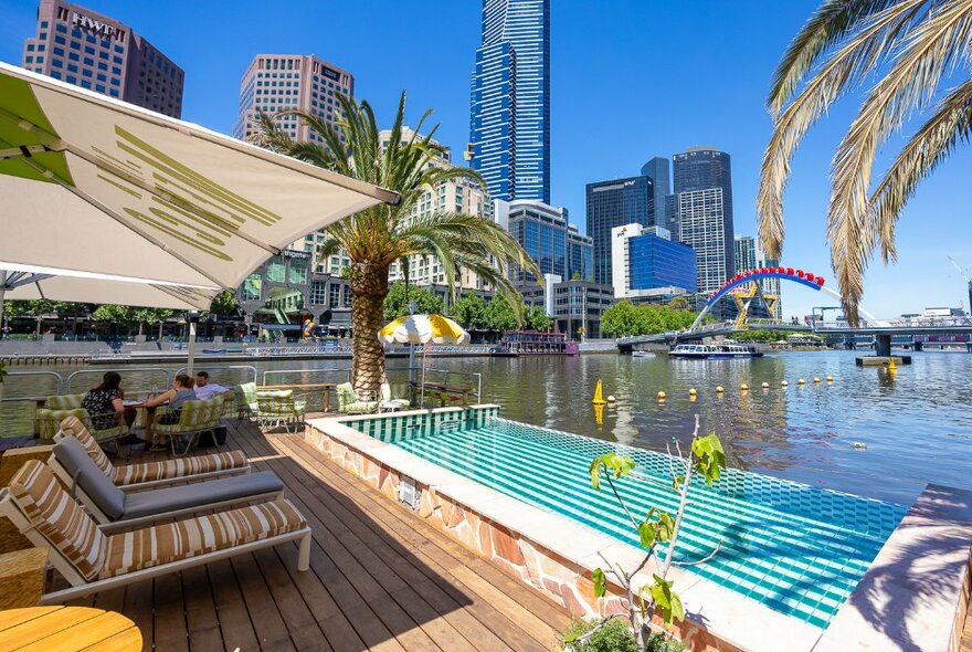 A sunny pool on a floating bar on the river.