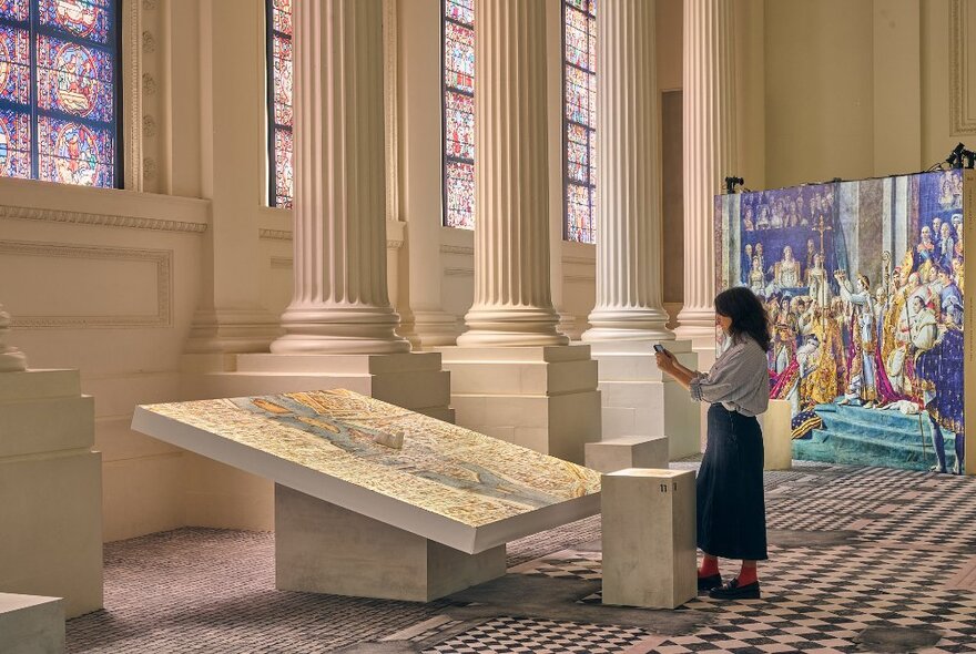 A museum patron at the Notre Dame exhibition. 