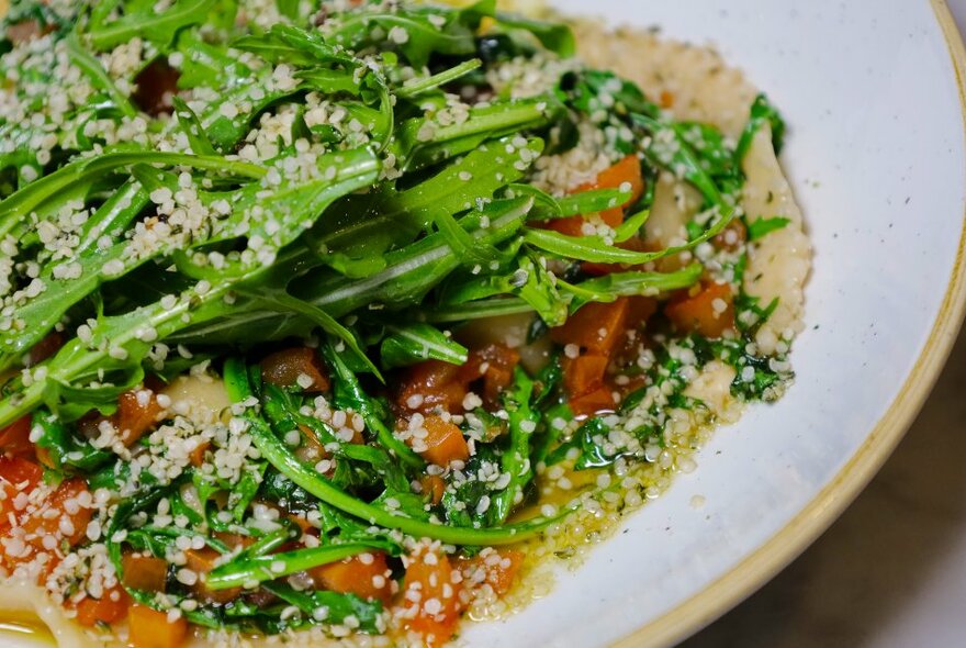 Roasted vegetables and couscous with rocket. 