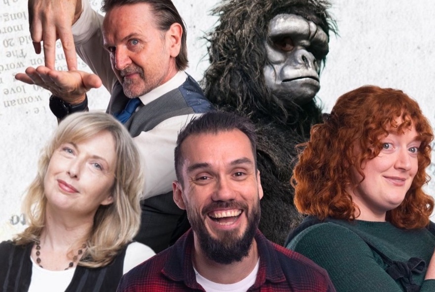 Four humans and gorilla smiling and laughing.