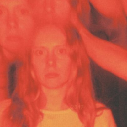 Blurred multiple image of a woman with blonde hair looking forward.